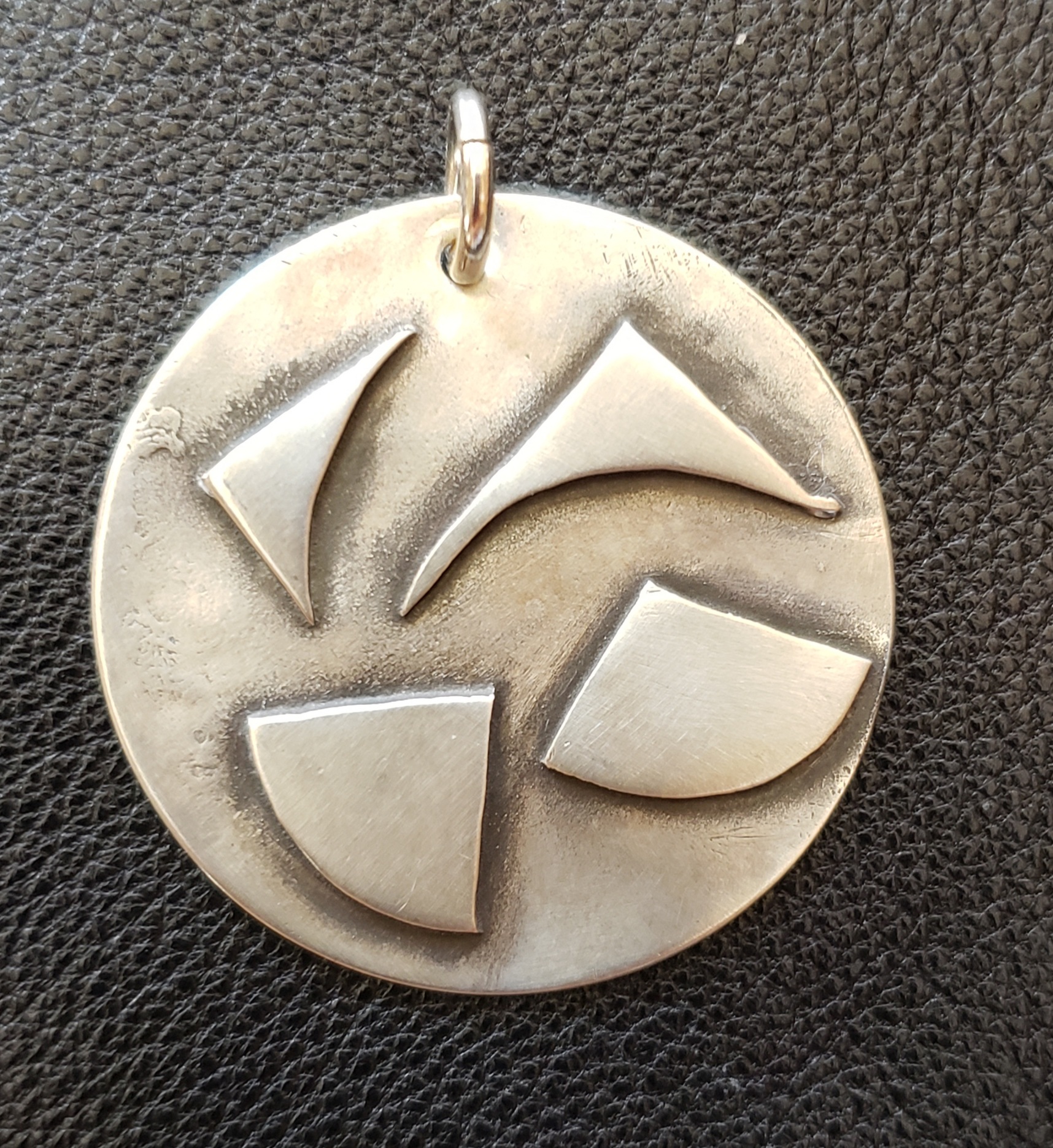 abstract sterling silver pendant handcrafted in the USA